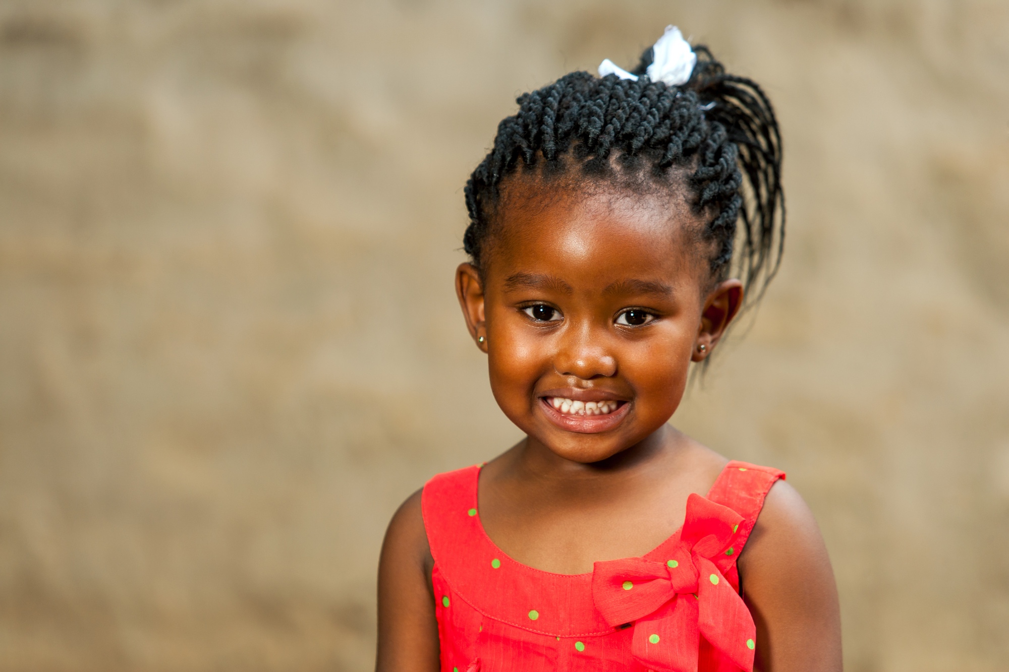 Little African Girl With Braided Hairstyle.